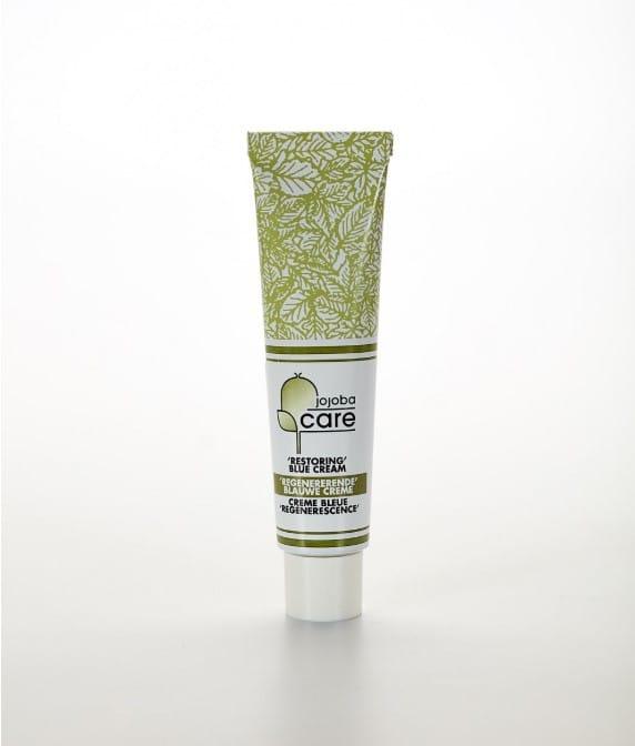 Tube de crème bleue régénérante Jojoba Care pour le soin de la peau.