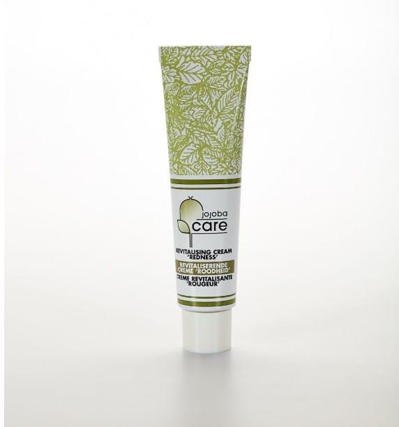 Tube de crème revitalisante Jojoba Care contre les rougeurs pour le soin du visage.