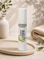 Lait universel Jojoba Care multi-usage pour le soin de la peau dans un décor naturel.